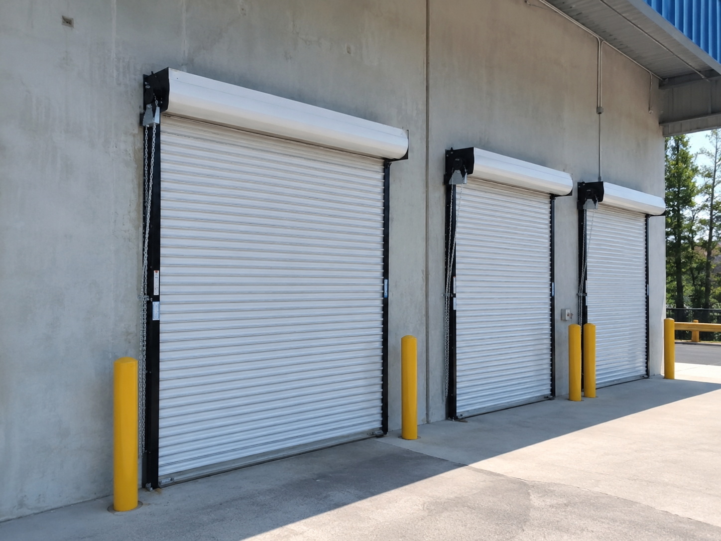 Oversized roll-up coiling door at a South Livermore winery and agricultural equipment barn